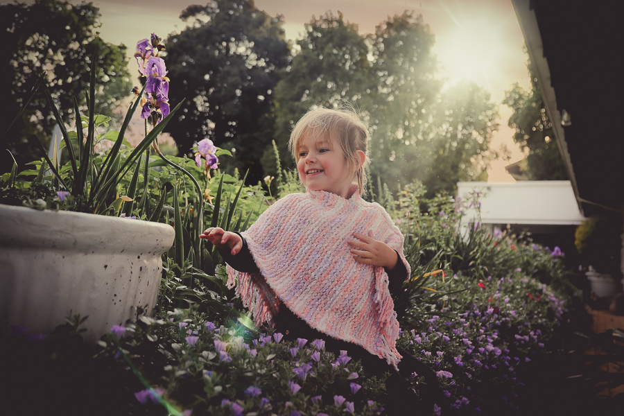 girl at sun rise in flowers